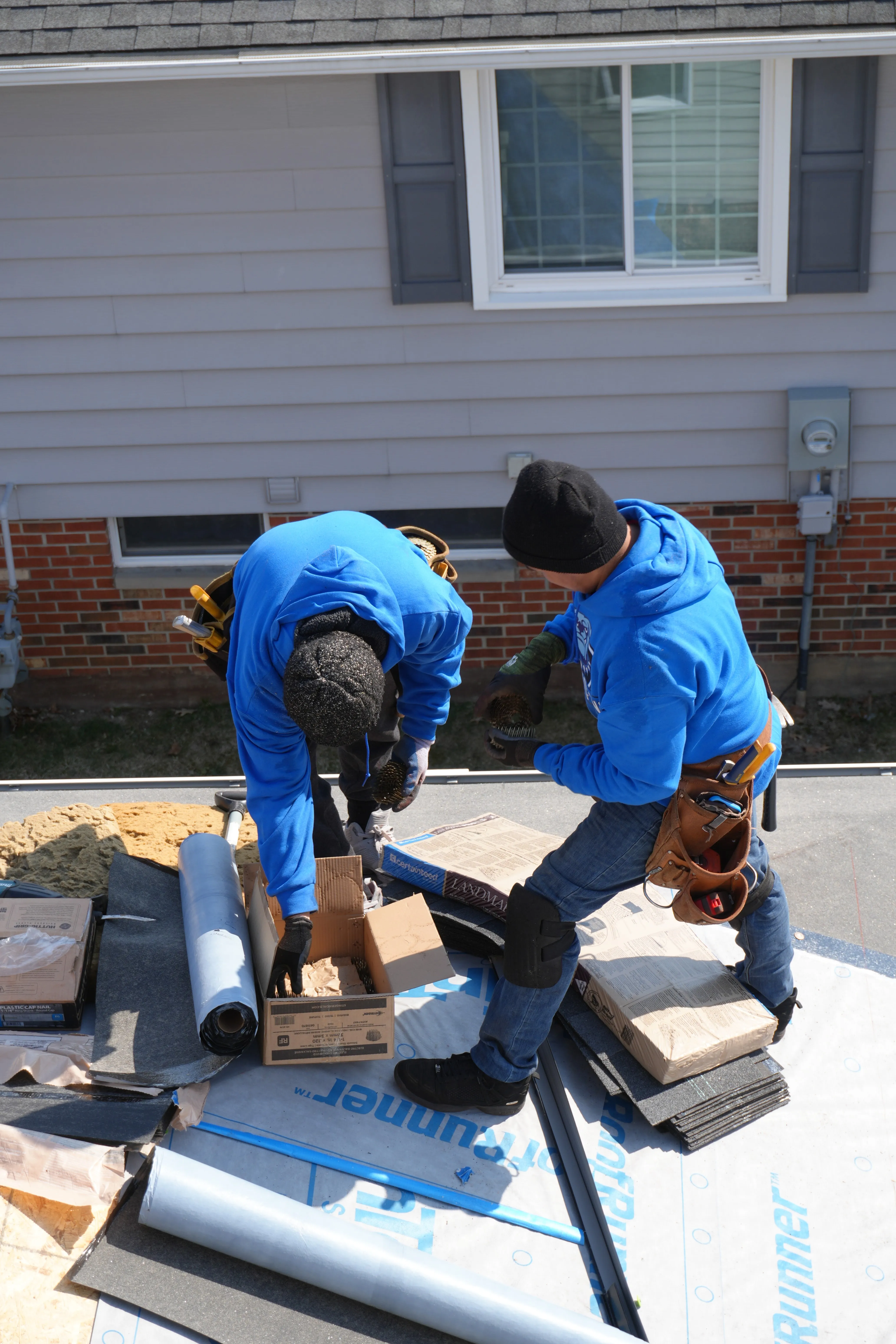 HOF Roofing crew installing architectural shingles on a home in Canton, Ohio